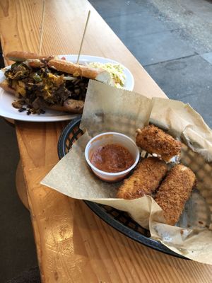 Steak and cheese sandwich with mozzarella sticks at The Butcher's Son in Berkeley