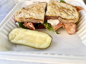Vegan BLT sandwich and pickle.￼ at The Butcher's Son in Berkeley