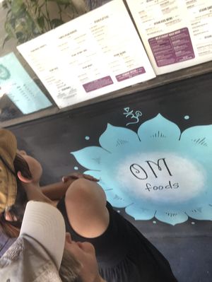 Checking out the menu outside, COVID-19-style... at OM Foods in Chico