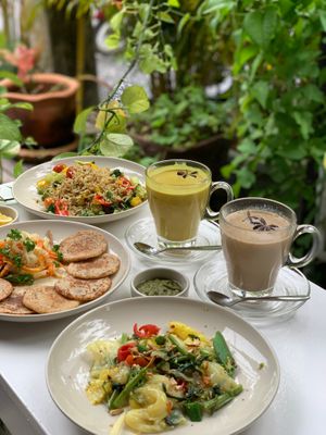 An ensemble of our favorite dishes - Ayu-Trix pancakes, paella and chai latte! All vegan, all beyond tasty!  at One Yoga Cafe in Koh Phangan