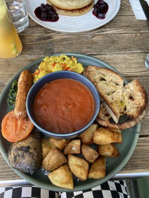 sausage, mushroom, sautéed spinach, scrambled tofu (so good!!!!), potatoes, tomato and sourdough   at Mildreds - Kings Cross in North London
