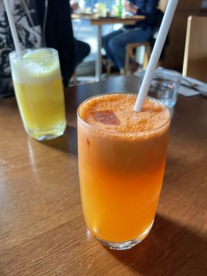 Freshly made apple carrot ginger juice   at Mildreds - Kings Cross in North London