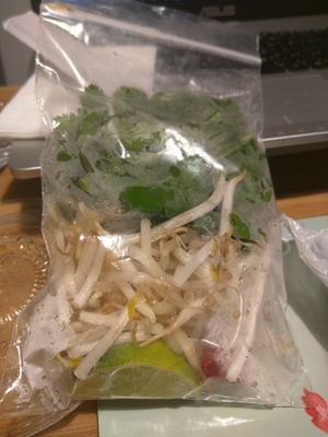 Fresh Herbs, Beansprouts, Chilli and Lime in separate packaging for Takeaway at Pho in Cambridge