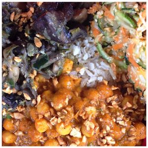 Bowl with whole grain rice, mushrooms, chickpeas, zucchini and roasted garlic as topping at The Pot - Calle 90 in Bogota