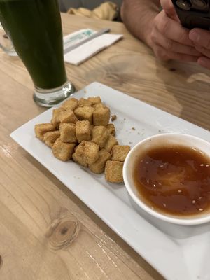 Crispy tofu bites appetizer and herbal lemonade   at Seitan Urban Bistro in Lima