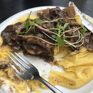seitan with mushroom gravy on puréed potatoes  at Seitan Urban Bistro in Lima