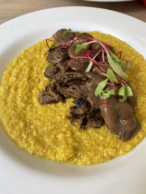 Quinotto al aji amarillo, seitan medallions & mushrooms saucee  at Seitan Urban Bistro in Lima