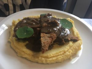 Seitan patty, mushroom gravy, whipped mashed potatoes at Seitan Urban Bistro in Lima