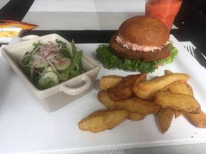 Seitan burger with slaw, REALLY GOOD crispy fresh cut fries. at Seitan Urban Bistro in Lima