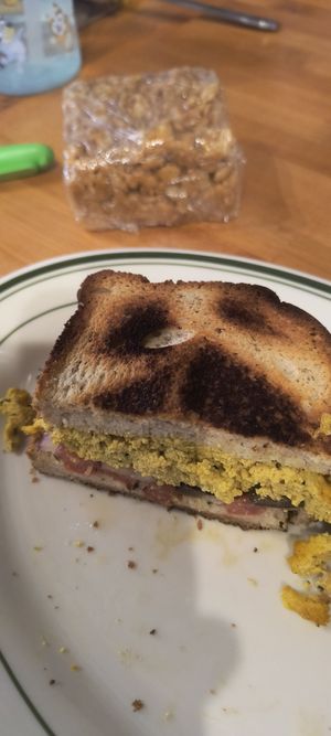 Vegan gluten free Mediterranean "wrap" and PB rice krispie treat. at Kavarna Coffeehouse in Green Bay