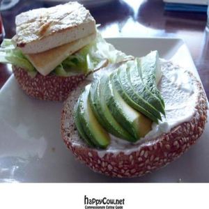 grilled tofu burger served with lettuce, alfalfa sprouts and tomatoes on an organic bun.  at Vegan Plate in Studio City