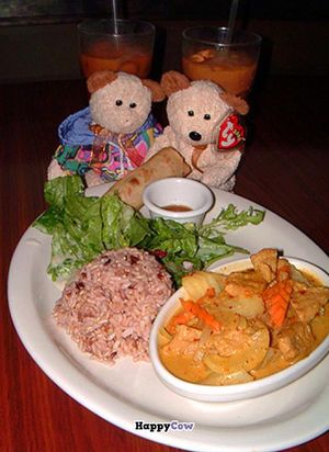 Yellow curry dinner with Thai iced tea.  
(Teddy Bears not included with dinner, although one seems to be making off with my spring roll.) at Vegan Plate in Studio City