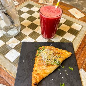 Mushroom pastry & cold pressed fresh juice with beetroot, orange and ginger  at Biokalma in Mallorca