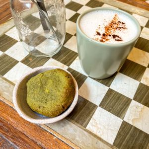 Chai latte & gf matcha pistachio cookie  at Biokalma in Mallorca