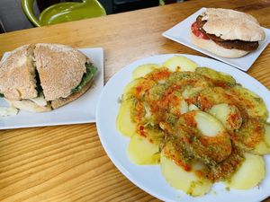 Bocadillo de setas, papas con mojo, choripan  at La Alpargata in Madrid
