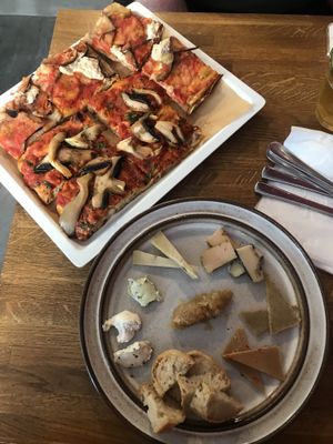 Eggplant pizza, mushroom pizza and cheese board  at MADENITALY in Copenhagen