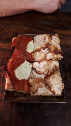 Eggplant and cashew cheese (left) and cauliflower cream and celeriac (right). Half slice of each  at MADENITALY in Copenhagen