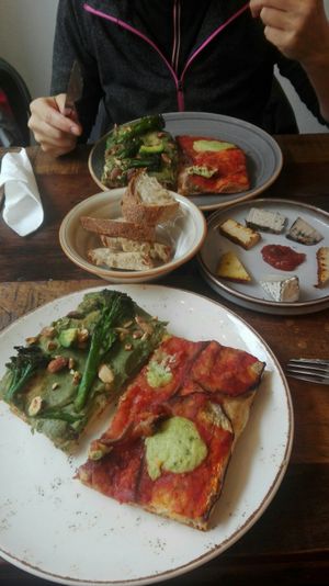 Pizza and cheese board at MADENITALY in Copenhagen