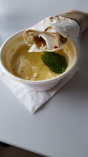 Humus with a wrap. Humus was delivered in a paper plate :) at MonkeyFood in Minsk