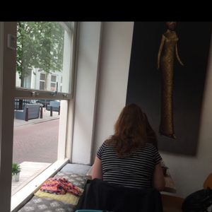 sitting in the window at Creme Coffee and Pastry in Den Bosch
