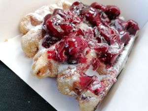 Waffle with powdered sugar and cherries at Het Zaanse Bakkertje / Dutch Vegan Bakery in Zaandijk