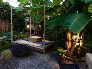 Garden seating by night at Pink House Garden in Chiang Mai