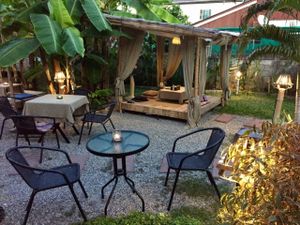 Garden seating at twilight at Pink House Garden in Chiang Mai
