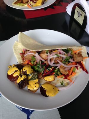taco with rice, seitan, hummus and veggies. potatoes and zucchini with huancaina sauce. appetizer was stuffed avocado (no picture!) at Sinfonia Vegana in Lima