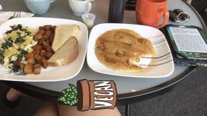 Spinach and tofu scramble with home fries and a banana pancake at The Purple Rooster Cafe in Attleboro