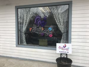The front window at The Purple Rooster Cafe in Attleboro