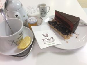Chocolate and Raspberry cake with a cup of tea. at Vis a Vis Vincek Cake and Ice Cream in Zagreb