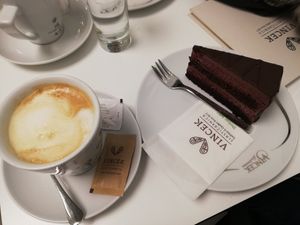 Almond milk caffelatte and cake at Vis a Vis Vincek Cake and Ice Cream in Zagreb