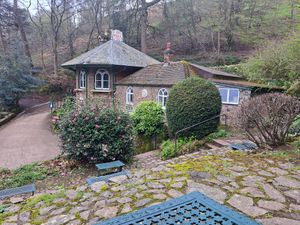 Exterior- lots of outdoor benches/tables at St Ann's Well Cafe in Malvern