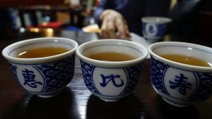 Tea cups with chinese name characters 惠比寿 at Ebisu Soba in Takayama