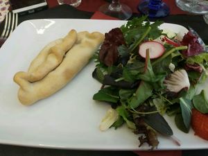 Tomato and basil Empanada with salad at El Pati de la Veina in Girona