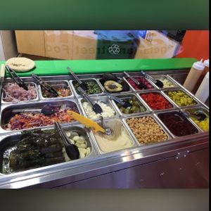 The array of healthy toppings. Freshly made twice a day so you can taste the freshness in every bite. Only one non-vegan topping, crumbled Feta.  at Falafelle in Belmont