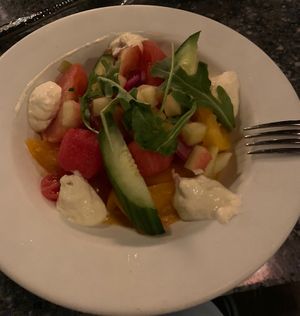 Heirloom tomato, watermelon, cucumber salad (with dollop of yumminess)  at Disneyland - Blue Bayou in Anaheim