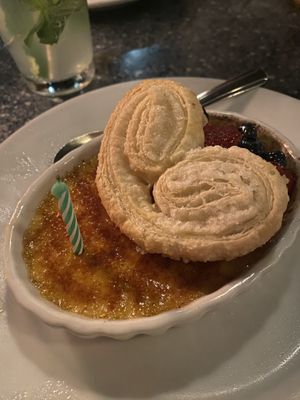 Creme brûlée was amazing and they even added a birthday candle 🥹  at Disneyland - Blue Bayou in Anaheim