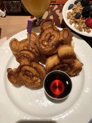 Vegan Mickey Mouse shaped waffles with syrup   at Disneyland - Storytellers Cafe in Anaheim
