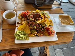 Nachos with vegan ground and house made queso and hot tea at Venti's Cafe and Taphouse in Salem