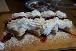 Waffles with jam and cream  at Bonobo Cafe in Aberdeen