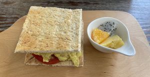 Scrambled bean curd and tomato sandwich with fresh fruit at LN Fortunate Coffee in Hong Kong Island