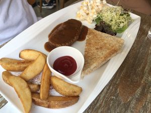 Pan-fried vegan steak with black pepper sauce set with toast, salad and wedges  at LN Fortunate Coffee in Hong Kong Island