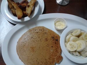Vegan pancakes with banana, homefries at Good Karma Coffee House in Decatur