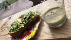 Matcha froth and avocado toast 🤤 at Under the Mango Tree in Miami Beach