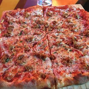 Vegan pizza with vegan sausage  at Pizza J in Providence