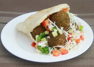Falafel hummus sandwich.
Home made Pita bread staffed with hummus fresh chopped salad and falafels
 at Falafel Sihanoukville in Sihanoukville