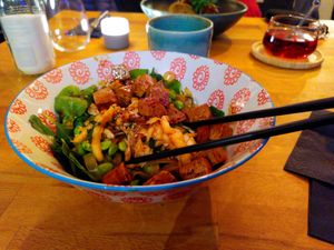 Teriyaki Tofu Bowl with rice noodles, edamame, kimchi, koriander, spinach, and sesame  at Zwei und Zwanzig in Geisenheim