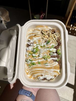 Seasoned red lentils over pasta— I selected onions, cashew cheese, & vegan sour cream as options at Umeke Market in Honolulu