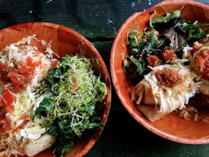 Crispy Burrito / $12 - Lentils, rice, arbol chili sauce, vegan cheese - topped with mac nut sour cream and served with a side salad at Umeke Market in Honolulu